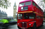 London double decker hop-on hop-off bus with open top with thames cruise